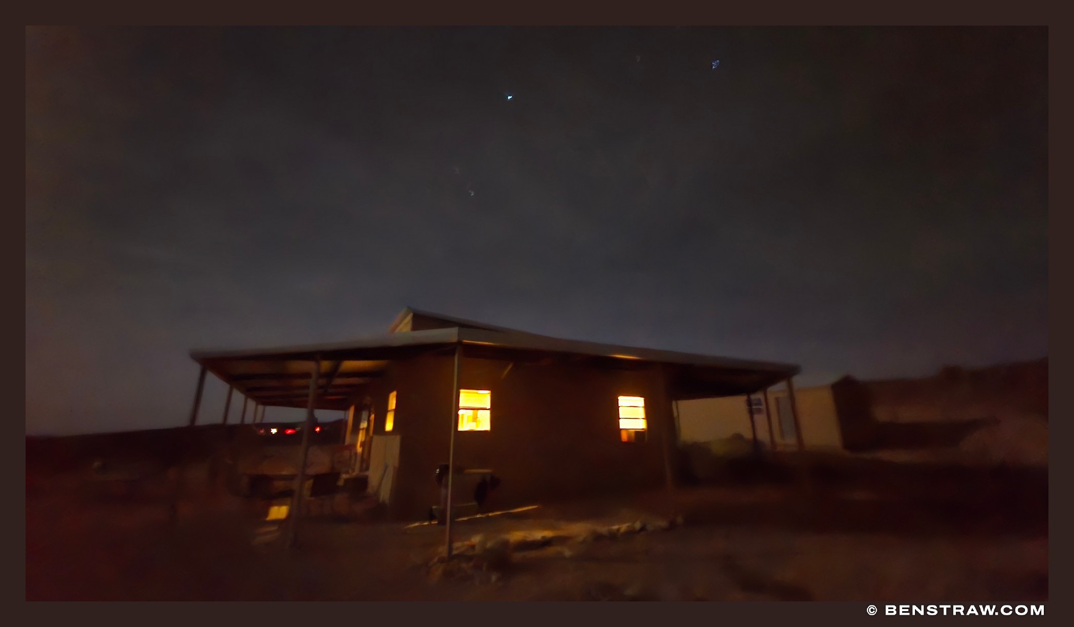 Lit Windows Beneath Desert Stars